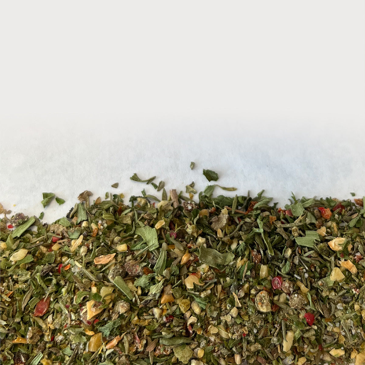 Close-up picture of Chicken & Fish Mix, scattered over a white background.