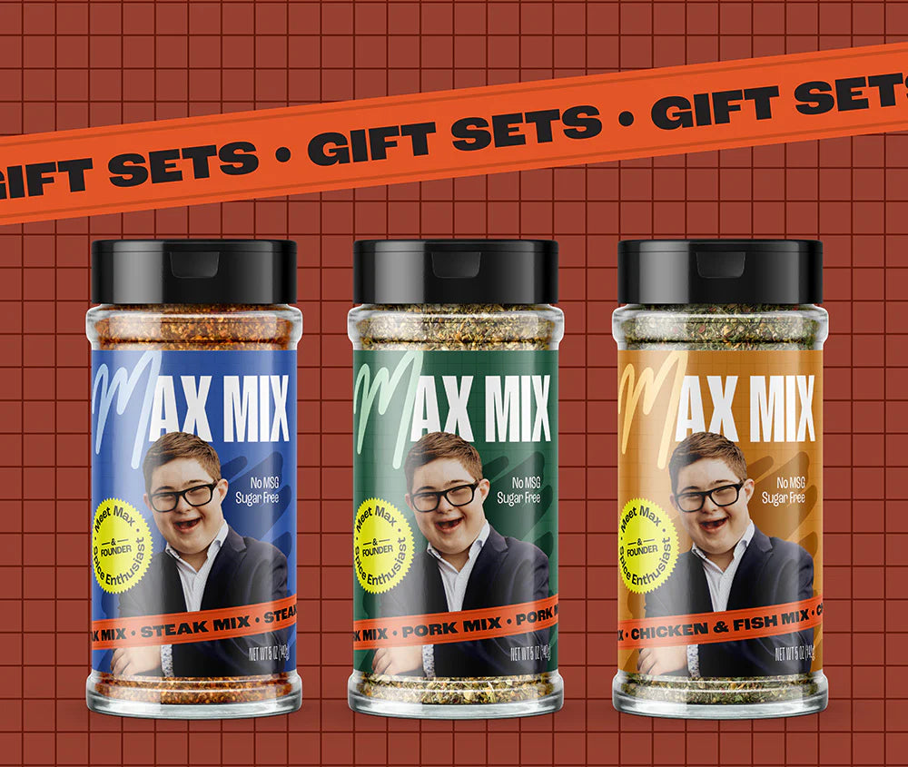 Shakers of the Max Mix products Steak Mix, Pork Mix, and Chicken & Fish Mix, on a dark red background with the heading "Gift Sets."